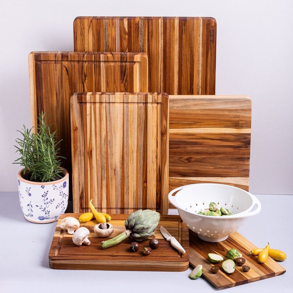 TeakHaus Edge Grain Cutting Board w/Hand Grip + Juice Canal (Rectangle) | 20" x 15" x 1.5" with Board Seasoning Stick TeakHaus Edge Grain Cutting Board W/Hand Grip + Juice Canal (Rectangle) | 20" X 15" X 1.5" With Board Seasoning Stick -All-Clad Shop 01.14 traditional 2